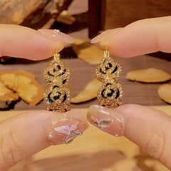 Close-up detail of the sparkling zircons and plating on the Flower Hoop Earrings