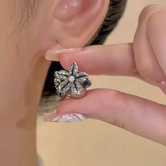 Close-up detail of the sparkling zircons and plating on the Starfish Stud Earrings