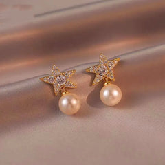 Angled view of the 18K Gold-Plated Diamond Star Pearl Earrings
