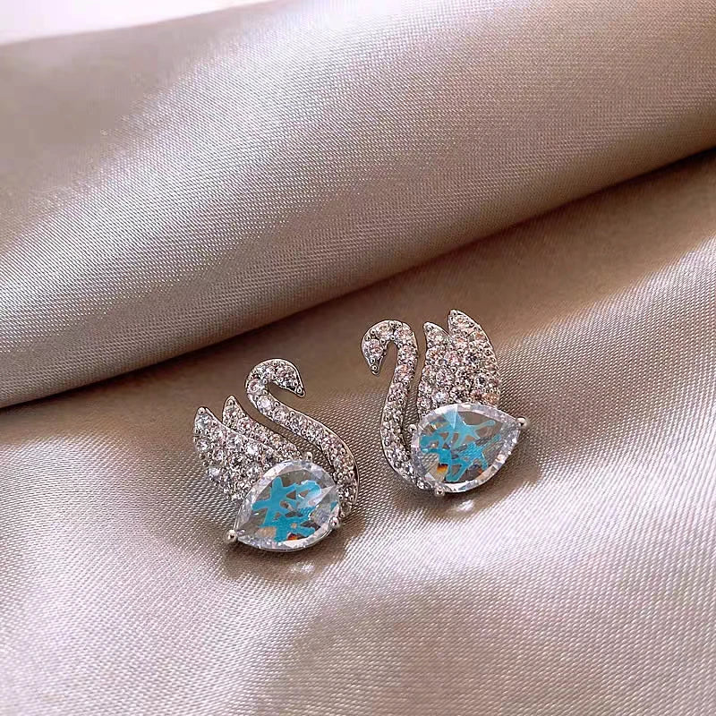Angled view of the 18K Gold-Plated Diamond Swan Earrings