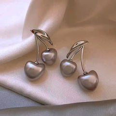 Close-up detail of the sparkling zircons and plating on the Cherry Earrings