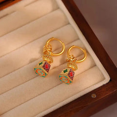Angled view of the 18K Gold-Plated Enamel Drip Glaze Bell-Shaped Earrings