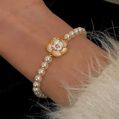 Close-up of the clasp and charm details on the Camellia Bracelet