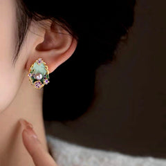 Model showcasing the dangle and style of the 18K Gold-Plated Garden Pearl Earrings