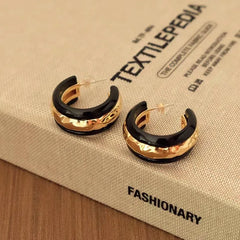 Angled view of the 18K Gold-Plated Glaze Texture C-Shaped Earrings