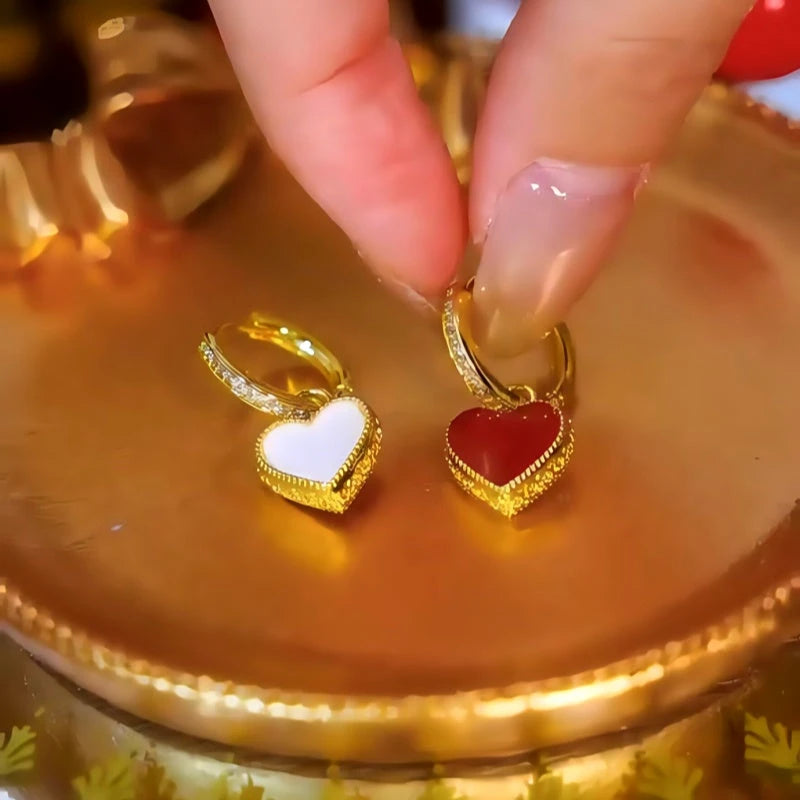 Angled view of the 18K Gold-Plated Heart Earrings