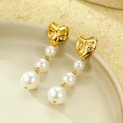 Close-up detail of the sparkling zircons and plating on the Heart Pearl Earrings