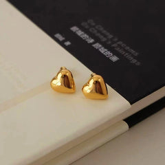 Close-up detail of the sparkling zircons and plating on the Heart Stud Earrings