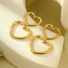 Close-up detail of the sparkling zircons and plating on the Double-Heart Earrings