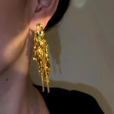 Close-up detail of the sparkling zircons and plating on the Leaf Tassel Earrings