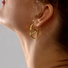 Close-up detail of the sparkling zircons and plating on the Letter V Earrings