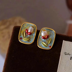Model showcasing the dangle and style of the 18K Gold-Plated Natural Pearl Flower Stud Earrings