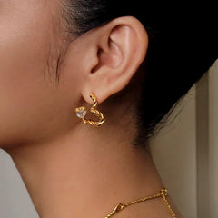 Gold twisted open heart CZ earring styled with gold rope chain necklace