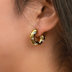 Model showcasing the dangle and style of the 18K Gold-Plated Zircon C-Shaped Earrings