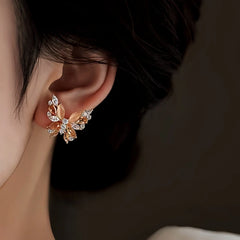 Model showcasing the dangle and style of the 18K Gold-Plated Zircon Cat's Eye Stone Butterfly Earrings
