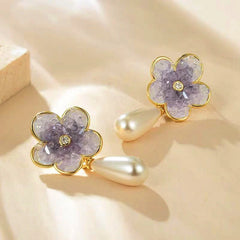 Close-up detail of the sparkling zircons and plating on the Pearl Earrings