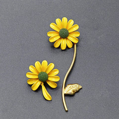 Angled view of the 24K Gold-plated Asymmetrical Daisy Flower Earrings