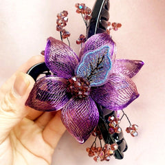 Angled view of the stylish Copper Wire Double-Sided Flower Hair Clips
