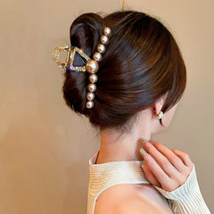 Close-up showing the material and craftsmanship of the Pearl Rhinestone Hair Clips