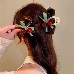 Angled view of the stylish Elegant Cherry Hair Clip