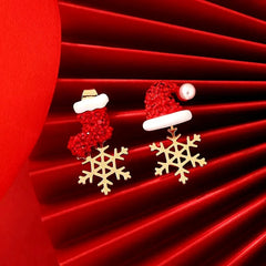 Angled view of the Silver Post Christmas Hat Boots Snowflake Earrings