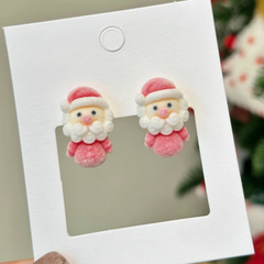 Angled view of the Silver Post Christmas Santa Flocking Earrings