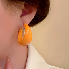 Model showcasing the dangle and style of the Silver Post Cute Candy Color C-shaped Earrings