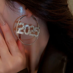 Model showcasing the dangle and style of the Silver Post Diamond 2025 New Year Hoop Earrings