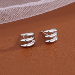 Angled view of the Silver Post Multi-Layer Claw Studs
