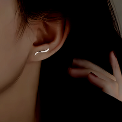 Model showcasing the dangle and style of the Silver Post Zircon Arc Stud Earrings