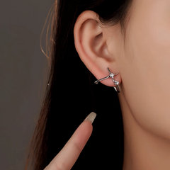 Model showcasing the dangle and style of the Silver Post Zircon Stud Earrings