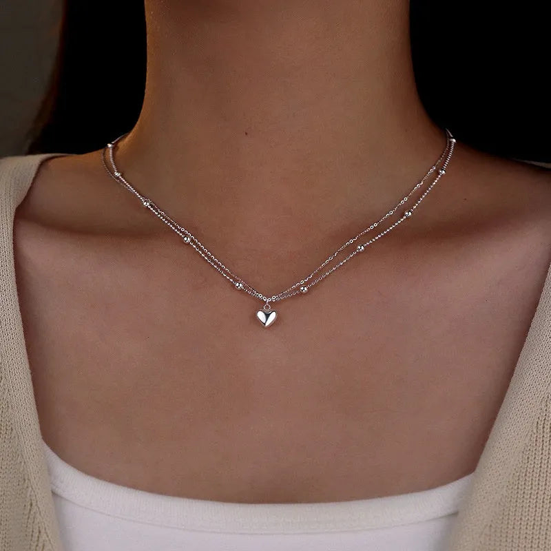 Close-up of the pendant and clasp on the Double-Layer Heart Necklace