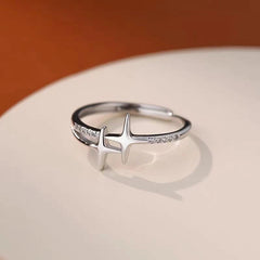 Top-down view of the sparkling Sterling Silver Adjustable Cross Star Diamond Rings