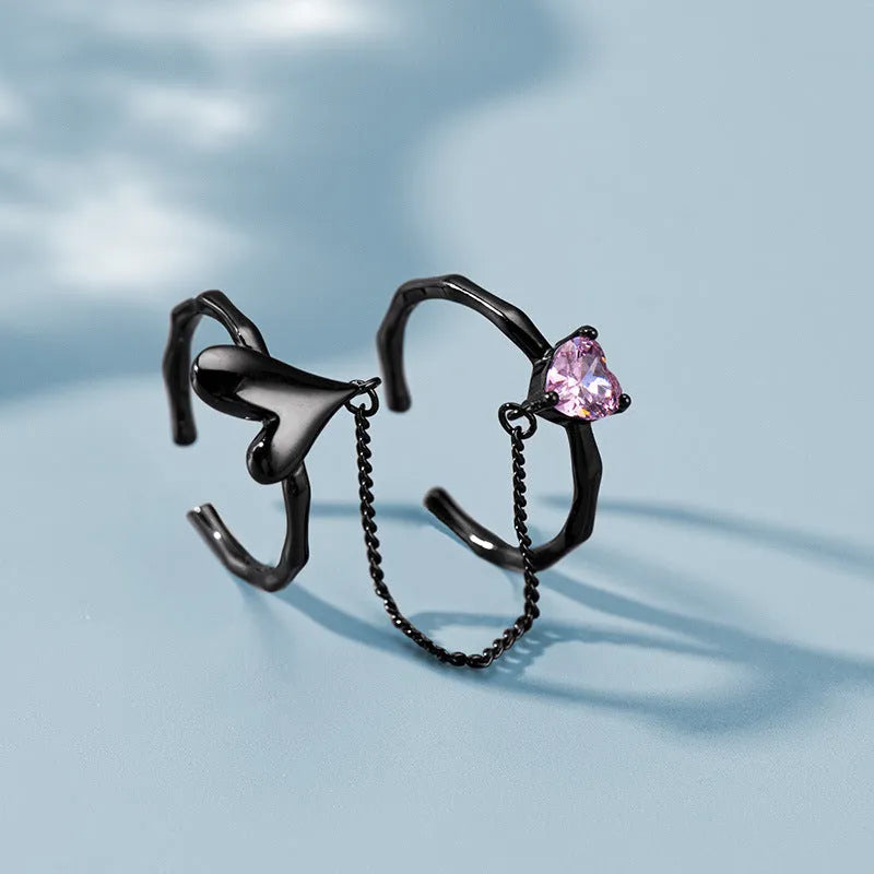 Top-down view of the sparkling Sterling Silver Adjustable Pink Diamond Love Rings
