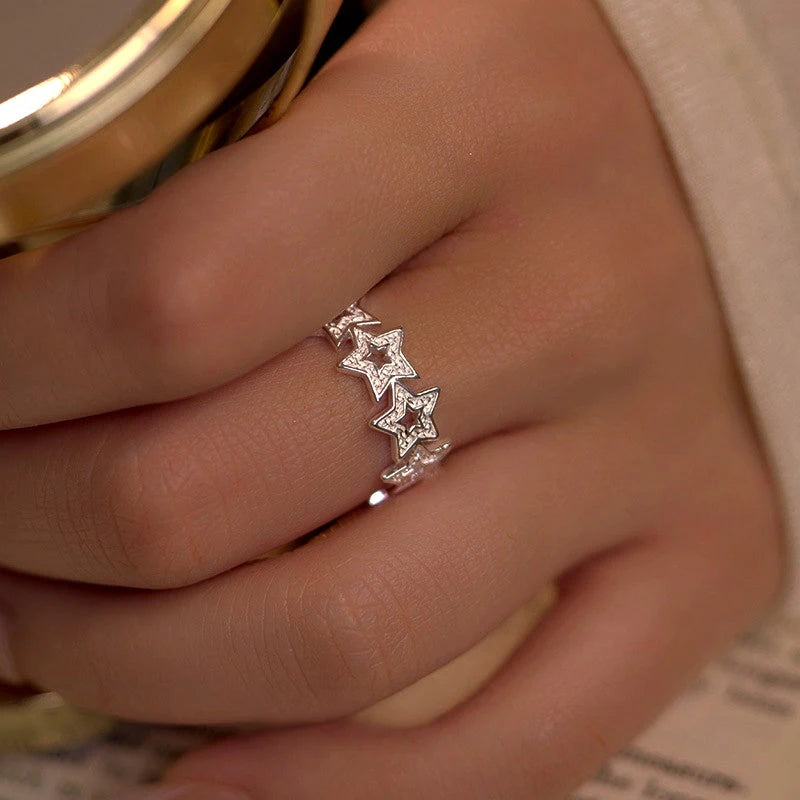 Close-up view of the gemstone and setting of the Adjustable Star Ring