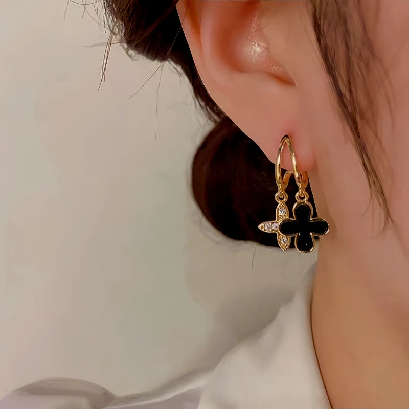 Close-up detail of the sparkling zircons and plating on the Clover Earrings