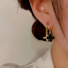 Close-up detail of the sparkling zircons and plating on the Clover Earrings