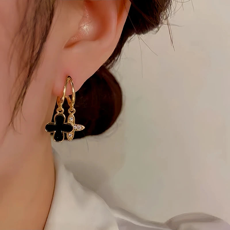 Model showcasing the dangle and style of the Sterling Silver Agate Four-Leaf Clover Earrings