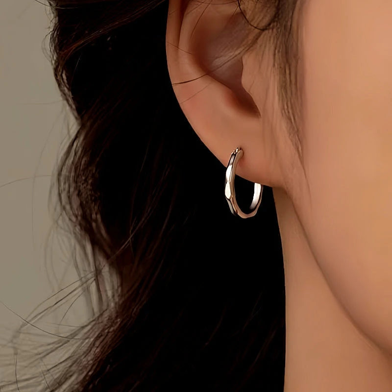 Close-up detail of the sparkling zircons and plating on the Bamboo Hoop Earrings