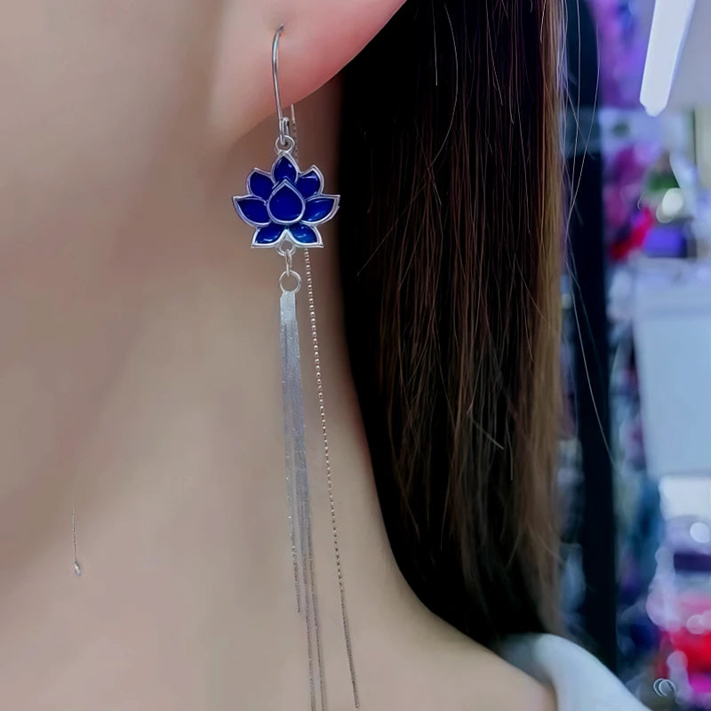 Model showcasing the dangle and style of the Sterling Silver Blue Lotus Tassel Threader Earrings