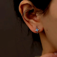 Model showcasing the dangle and style of the Sterling Silver Blue Zircon Star Ear Hook Earrings