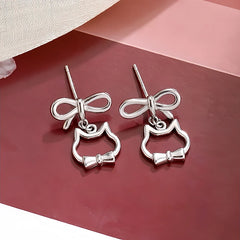 Angled view of the Sterling Silver Bow Cat Earrings