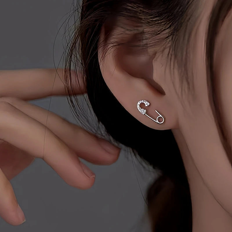 Model showcasing the dangle and style of the Sterling Silver Buckle Stud Earrings