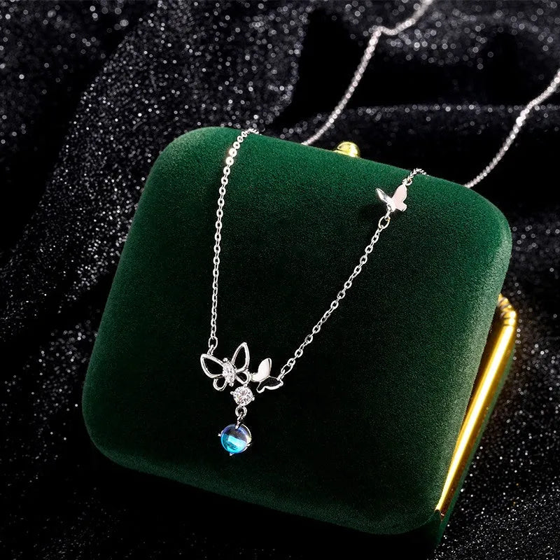 Detailed view of the Sterling Silver Butterfly Moonstone Tassel Necklace chain and pendant