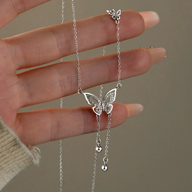 Sterling Silver Butterfly Tassel Necklace worn to showcase its length and pendant detail