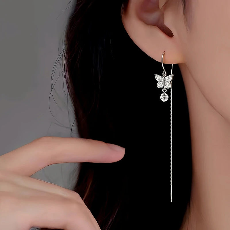 Model showcasing the dangle and style of the Sterling Silver Butterfly Threader Earrings
