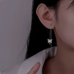 Model showcasing the dangle and style of the Sterling Silver Butterfly Threader Earrings
