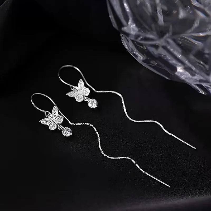 Close-up detail of the sparkling zircons and plating on the Butterfly Threader Earrings