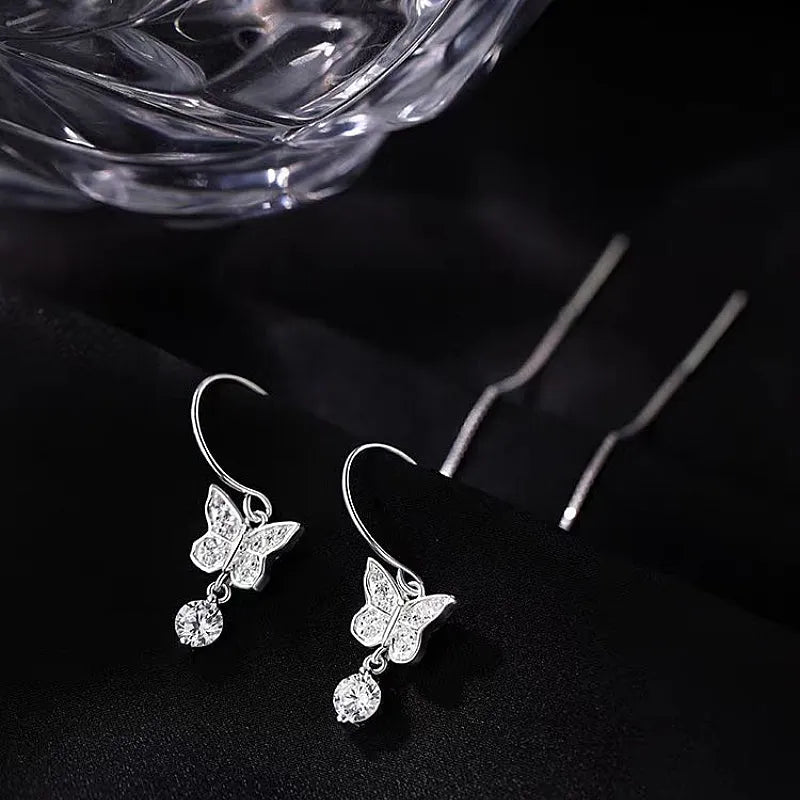 Angled view of the Sterling Silver Butterfly Threader Earrings