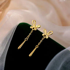 Angled view of the Sterling Silver Butterfly Water Drop Tassel Earrings